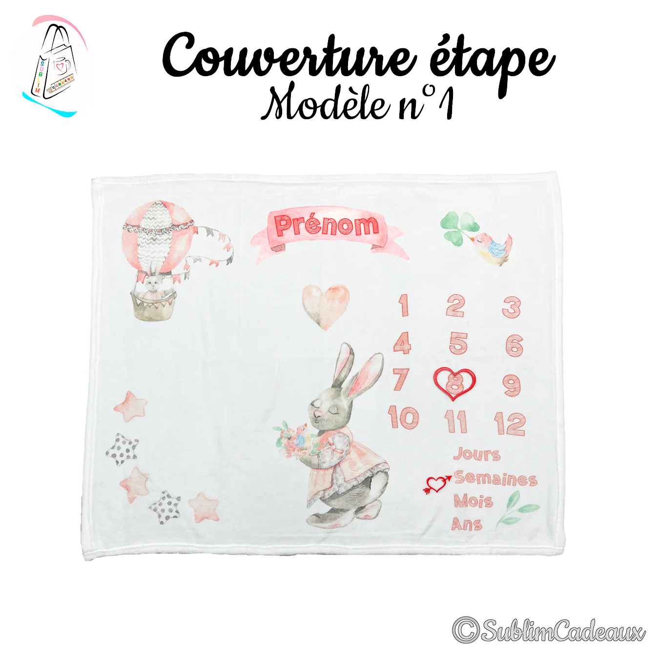 Couverture étape bébé blanche imprimée d'un lapin en robe, d'une montgolfière et de chiffres 1 à 12 rose corail