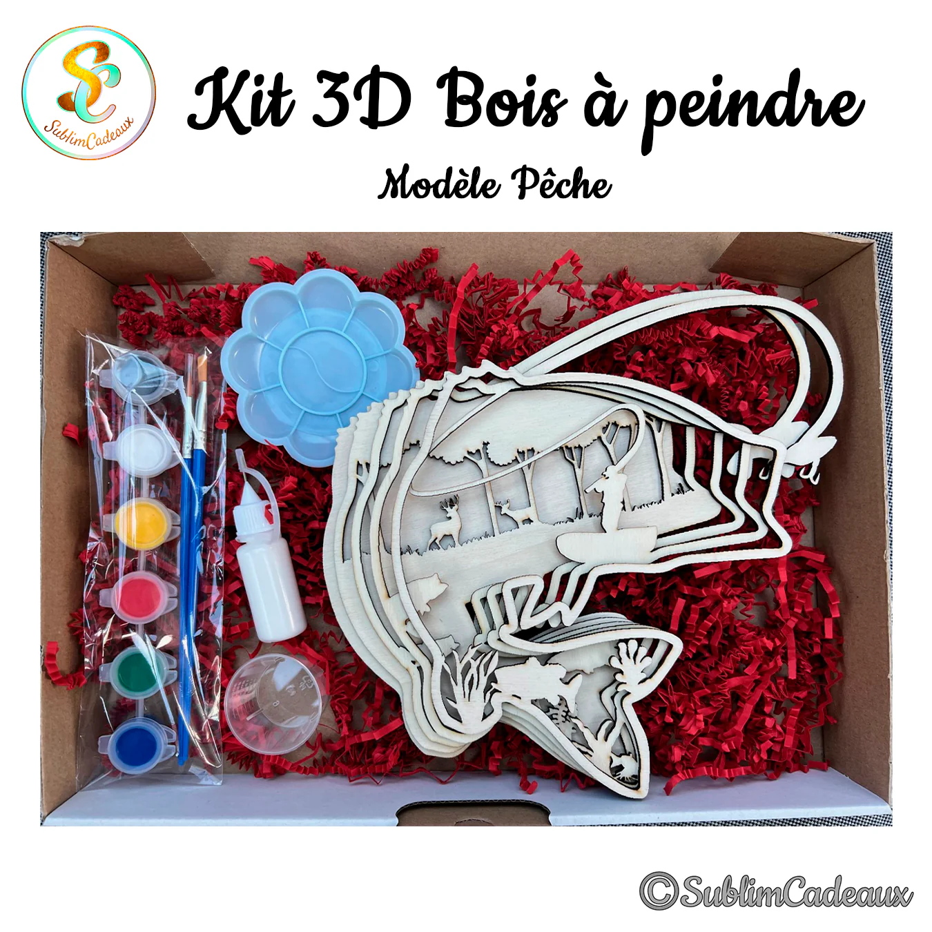 Kit à peindre avec poisson bondissant en bois découpé au laser sur décor de forêt, godets de peinture, pinceaux et palette bleue