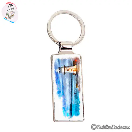 Porte-clés rectangulaire métallique orné d'un phare peint à l'aquarelle dans les tons bleus