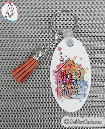Porte-clés ovale motif maison Home sweet home avec pompon caramel, visuel à personnaliser